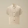 Camicia a maniche corte in popeline di cotone U16 con bottoni e lente
