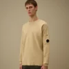 Maglione in cotone Sea Island con dettaglio a forma di Lens