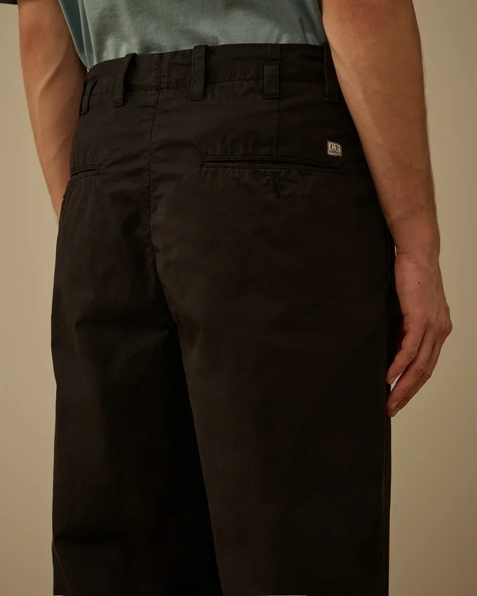 Pantaloni larghi con pinces in gabardina di cotone
