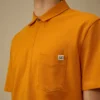 Polo a maniche corte con taschino sul petto in piquet elasticizzato